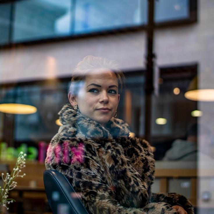 Kaveri Mehta, Lead Design Curator at Calm Focus Signal, reviewing corporate floral arrangements